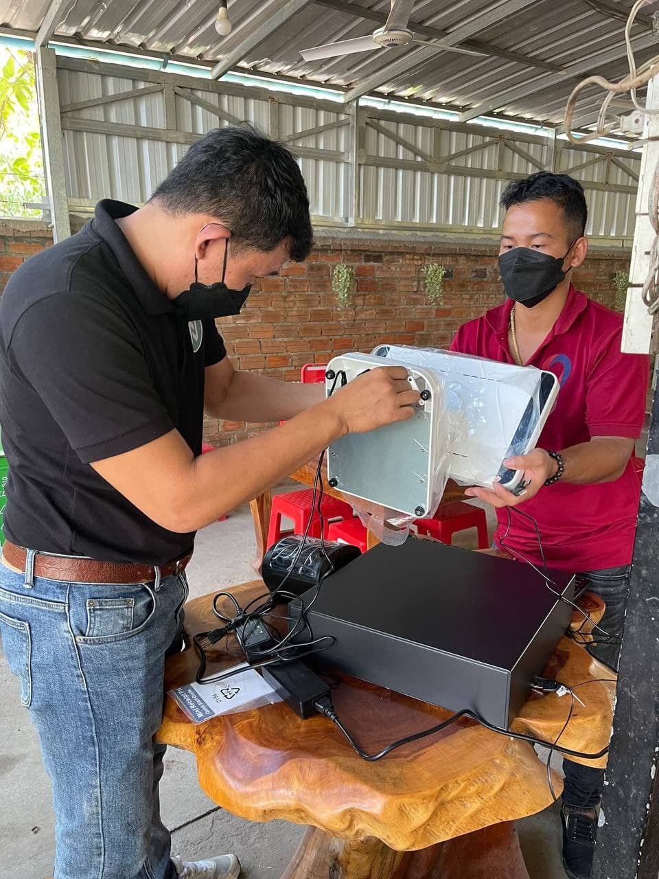 Unboxing and assembling POS hardware onsite